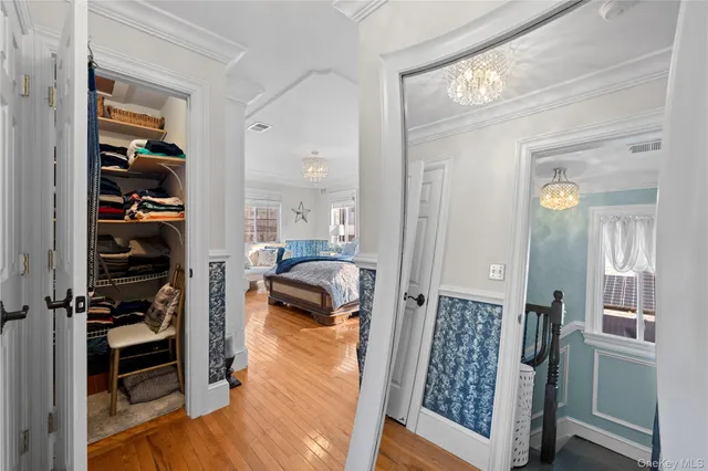 a view of a bedroom with a hardwood floor and a view of bedroom