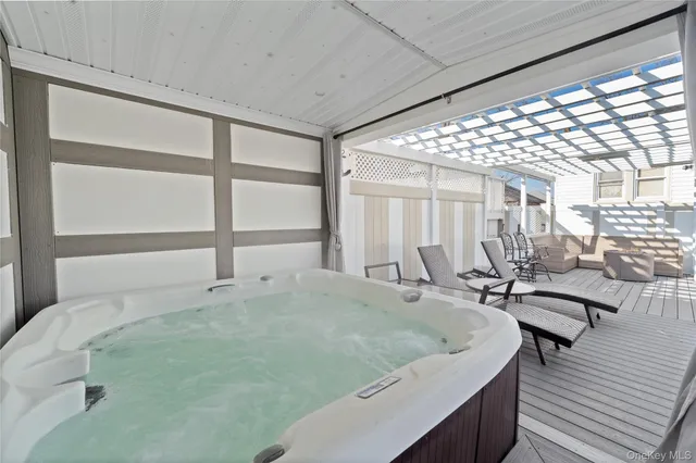 a room with pool table and windows