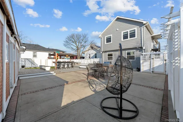 a view of a swimming pool with furniture