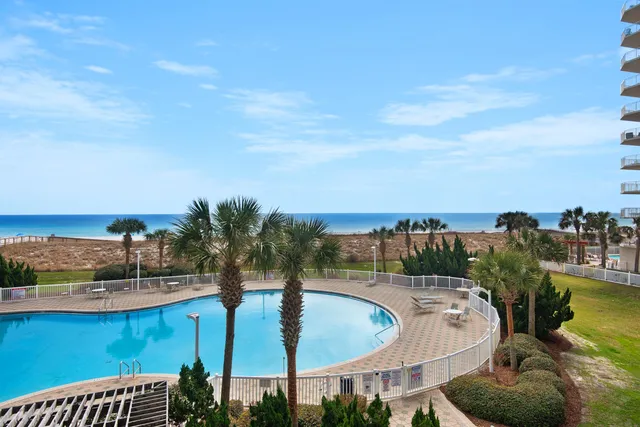 a terrace with outdoor seating and city view