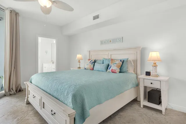a living room with flat screen tv and a dresser