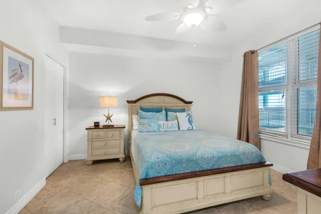 a bedroom with a large bed and a flat screen tv