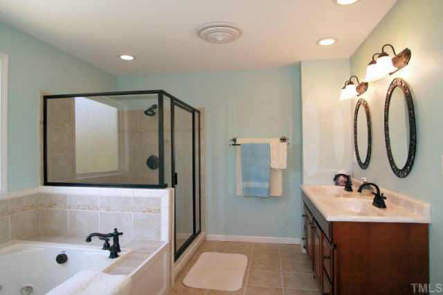613 Mial Street Raleigh, NC 27608 - Photo 8 of 10 Master bath offers a large tiled shower, double vanities, and whirlpool tub.