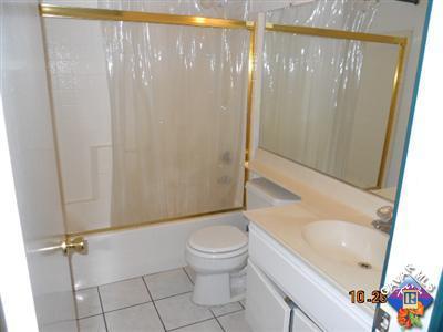 3249 Quarry Road Palmdale, CA 93550 - Photo 8 of 9 a bathroom with a sink toilet and shower