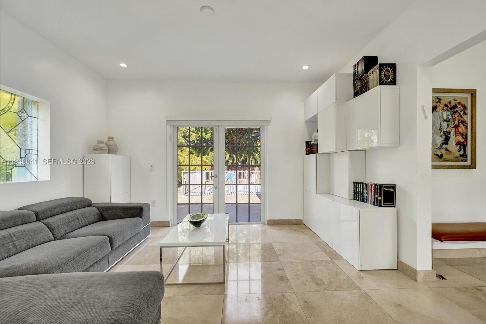 3757 Prairie Avenue Miami Beach, FL 33140 - Photo 11 of 19 a living room with furniture and a window