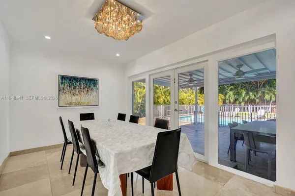 a view of a dining room with furniture window and outside view