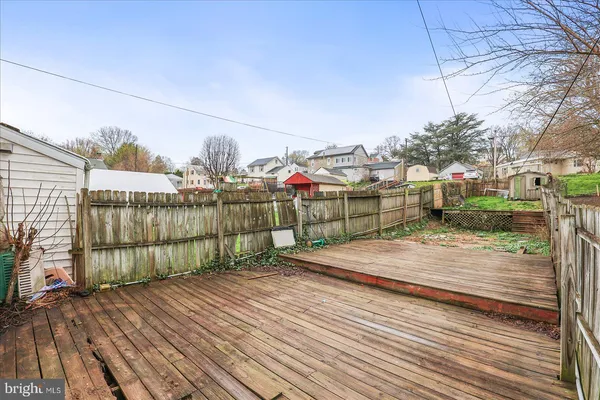 a view of a house with wooden deck
