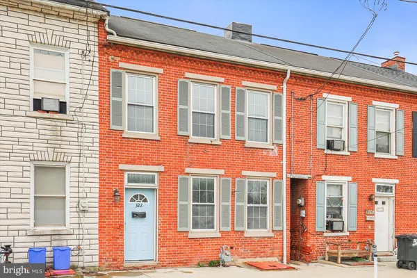 a view of brick building with many windows