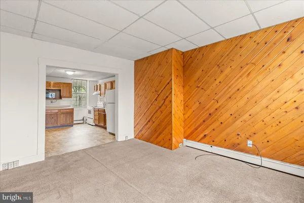 an empty room with a empty space and windows