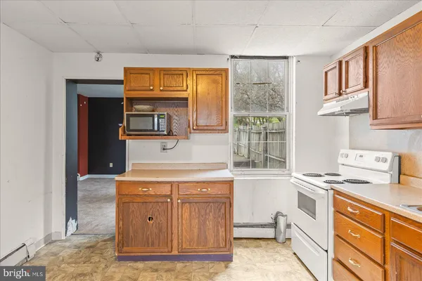 a view of an empty room with glass door