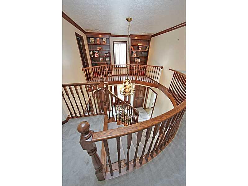 346 Germain Road Wexford, PA 15090 - Photo 12 of 20 Entry/Foyer. Wood railing cat walk with matching bookcases in upper level entry.