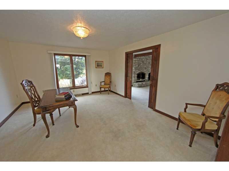 346 Germain Road Wexford, PA 15090 - Photo 5 of 20 Den. Den with wood pocket door overlooks pool area.
