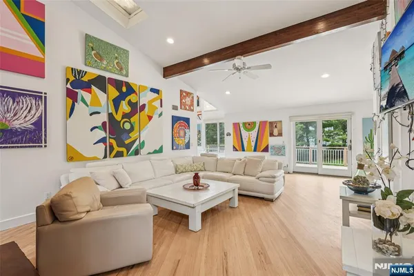 a living room with fireplace furniture and a wooden floor