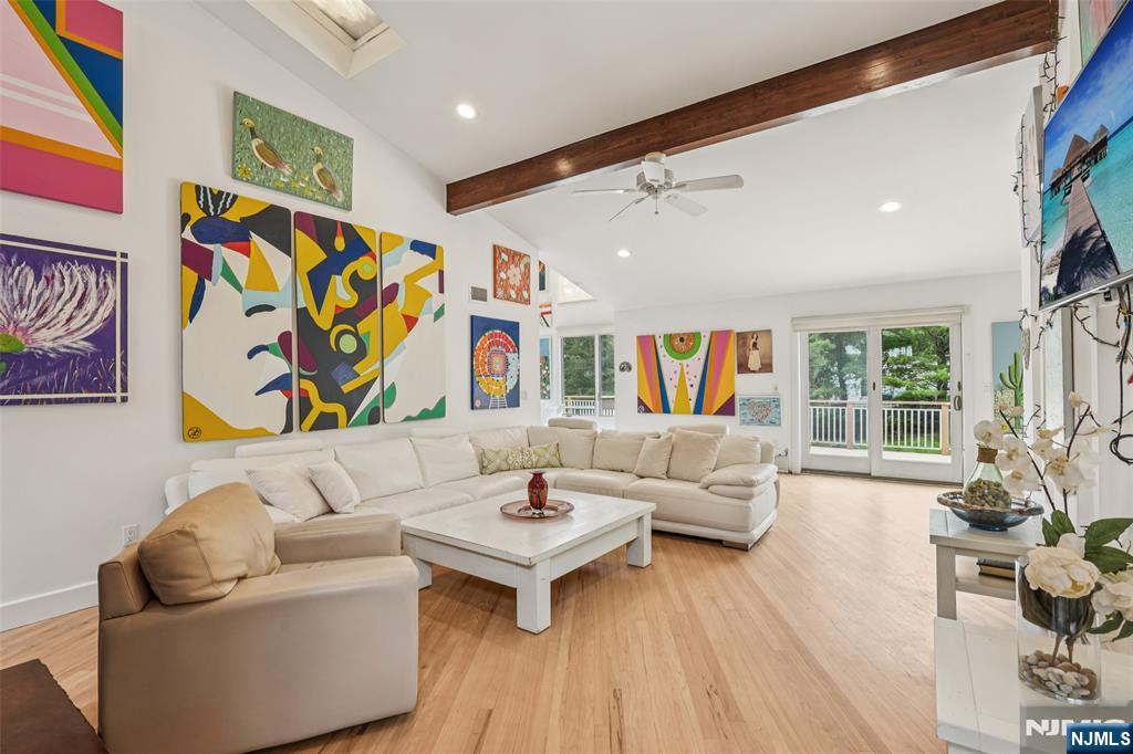 16 Schaffer Road Alpine, NJ 07620 - Photo 11 of 25 a living room with fireplace furniture and a wooden floor