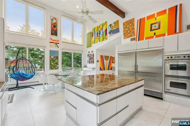 a view of kitchen island with granite countertop lots of counter top space