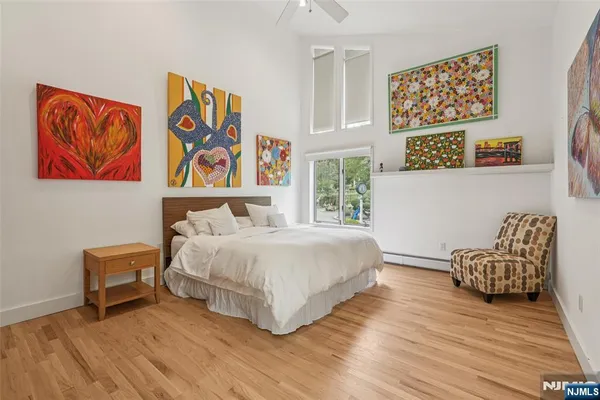 a bedroom with a bed and a chair