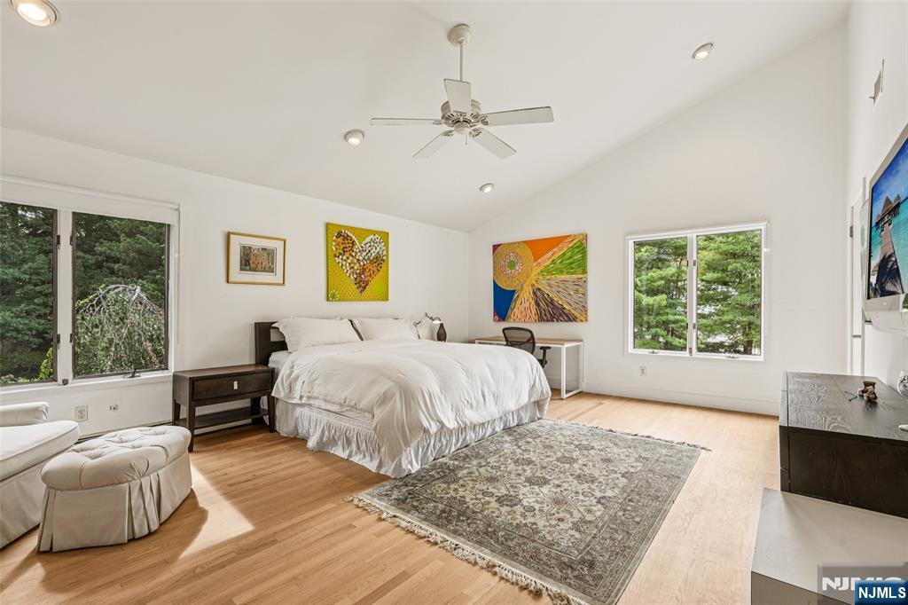 16 Schaffer Road Alpine, NJ 07620 - Photo 20 of 25 a spacious bedroom with a large bed and a window