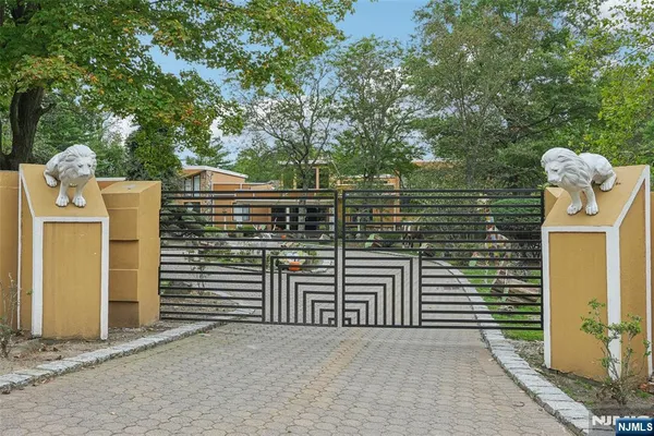 a front view of a house with trees
