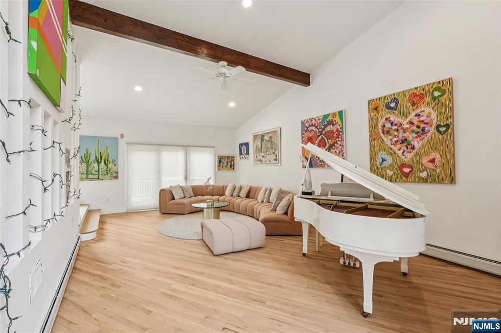 16 Schaffer Road Alpine, NJ 07620 - Photo 7 of 25 a living room with furniture and a wooden floor
