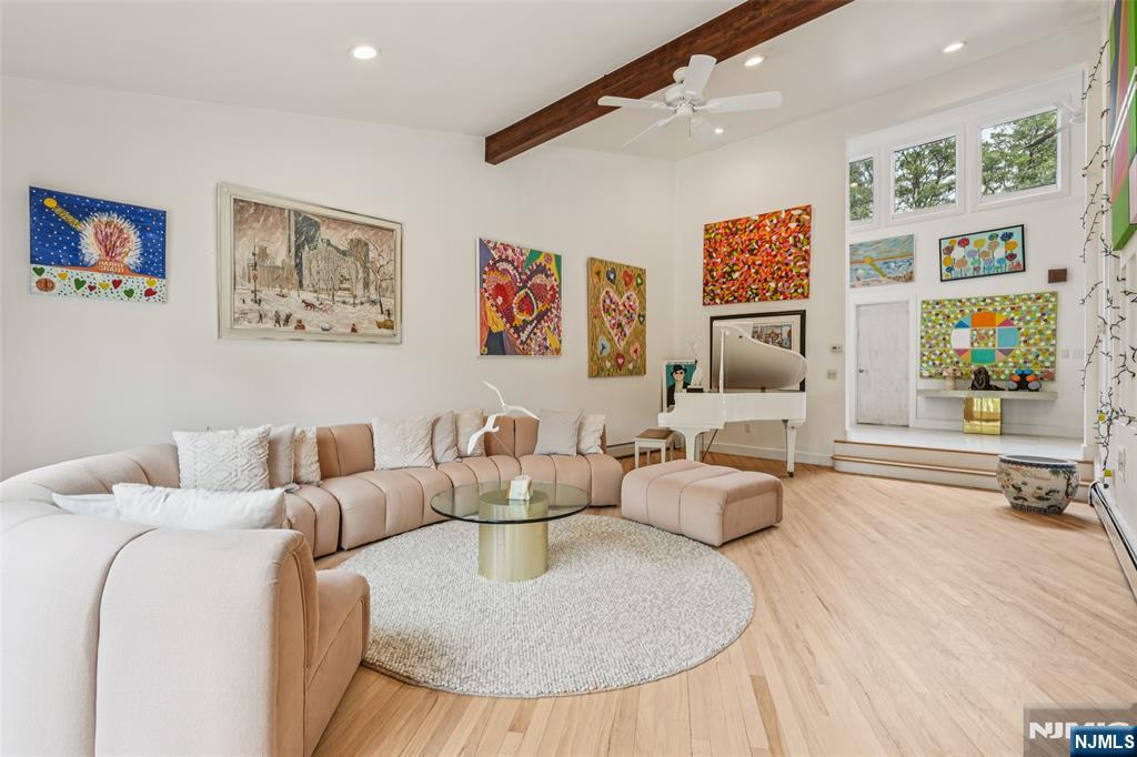 16 Schaffer Road Alpine, NJ 07620 - Photo 8 of 25 a living room with furniture and painting on the wall