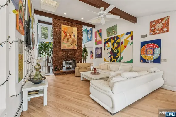 a living room with fireplace furniture and a flat screen tv