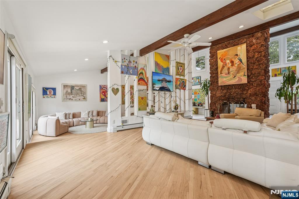 16 Schaffer Road Alpine, NJ 07620 - Photo 10 of 25 a living room with furniture and a large window