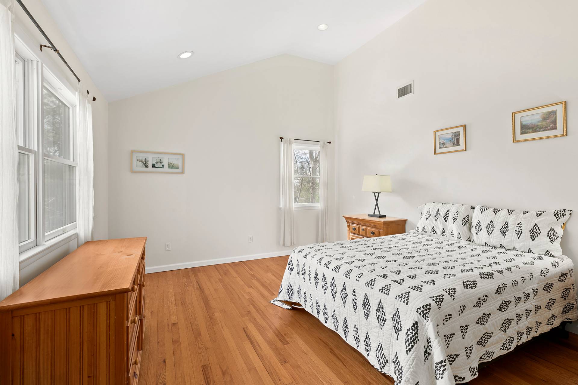 34 Old Fish Cove Road Southampton, NY 11968 - Photo 12 of 17 a bedroom with a bed and wooden floor
