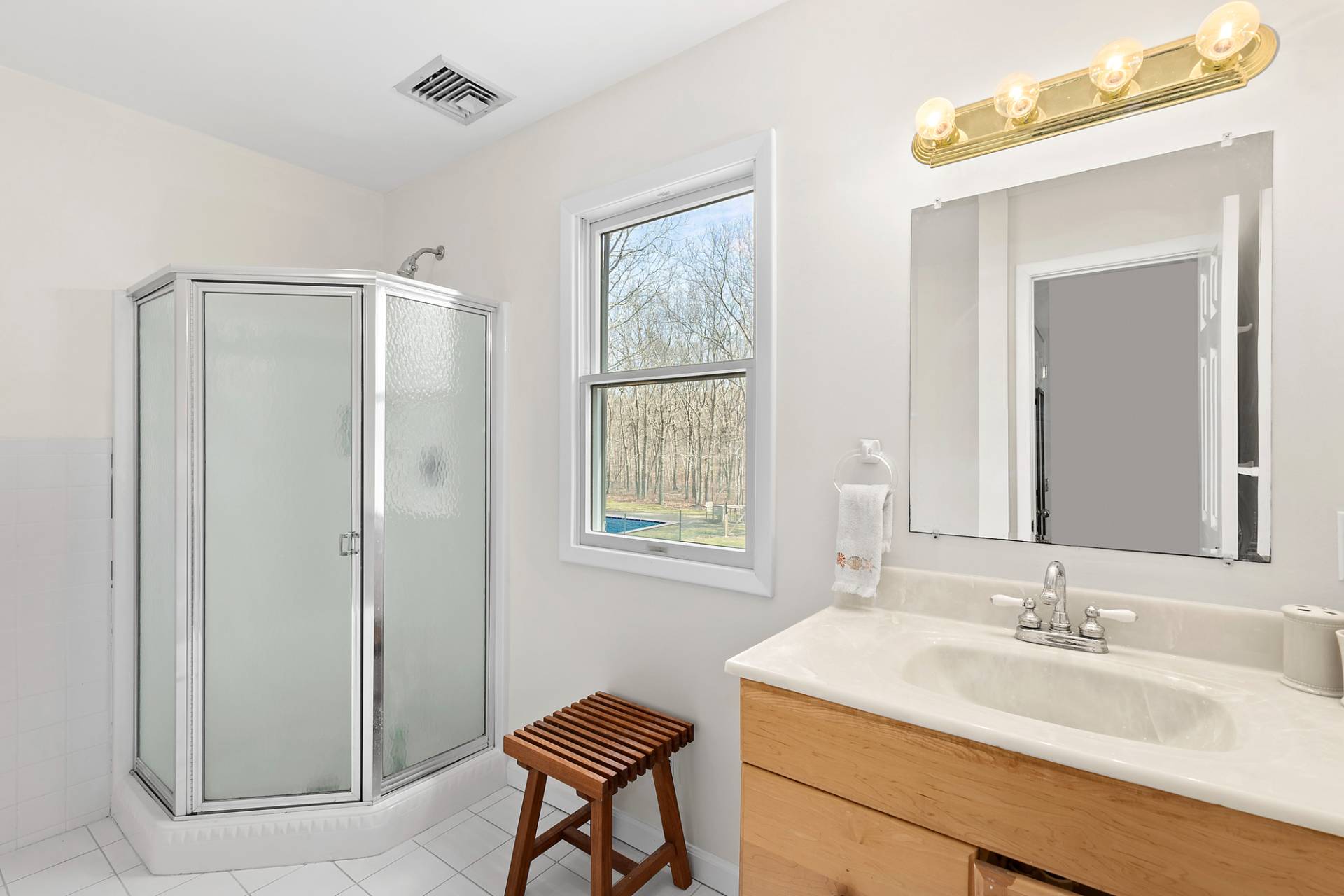 34 Old Fish Cove Road Southampton, NY 11968 - Photo 13 of 17 a bathroom with a granite countertop sink mirror and a toilet