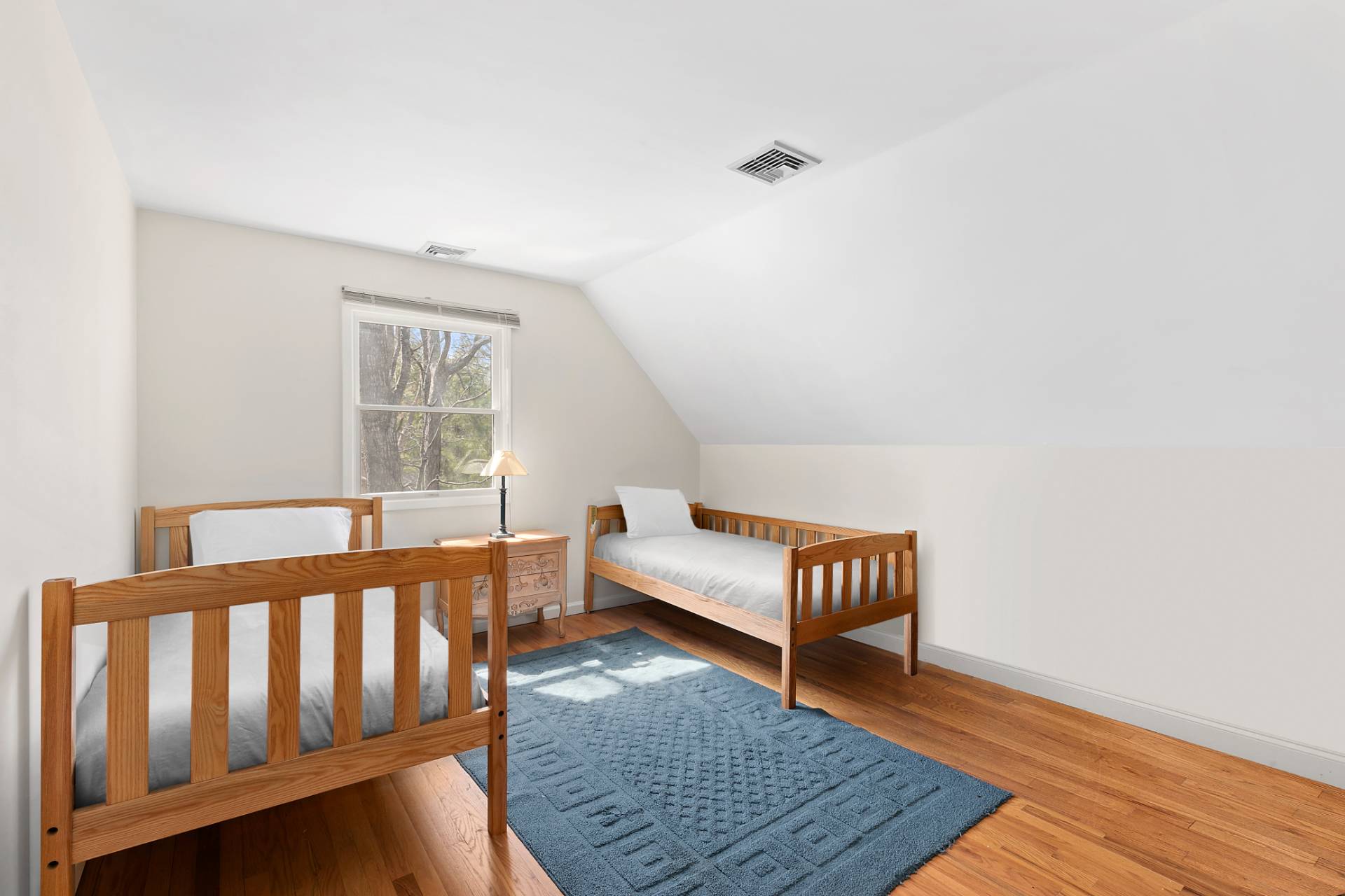 34 Old Fish Cove Road Southampton, NY 11968 - Photo 14 of 17 a bedroom with furniture and a window