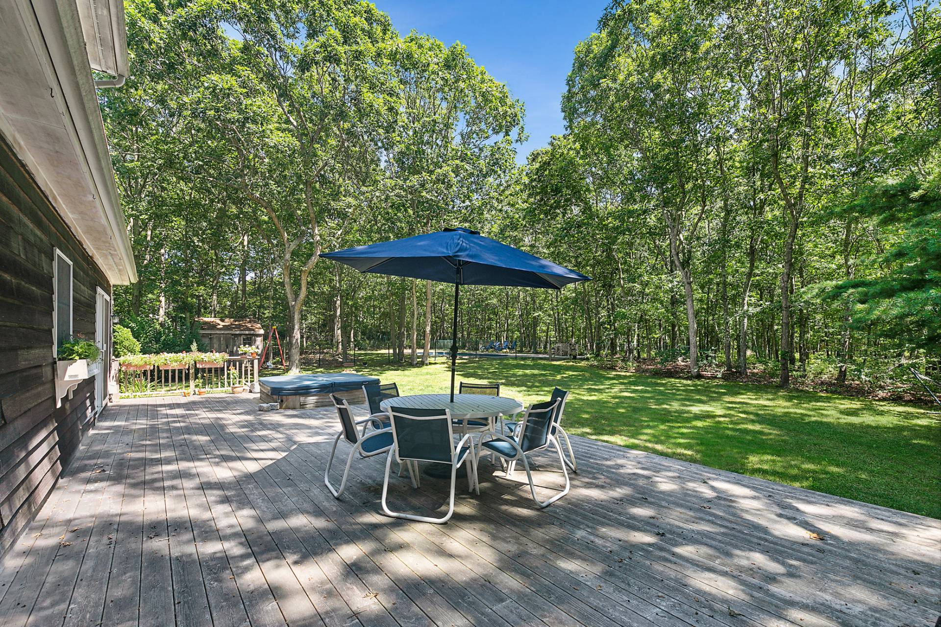 34 Old Fish Cove Road Southampton, NY 11968 - Photo 4 of 17 a view of backyard with outdoor seating a patio and outdoor seating