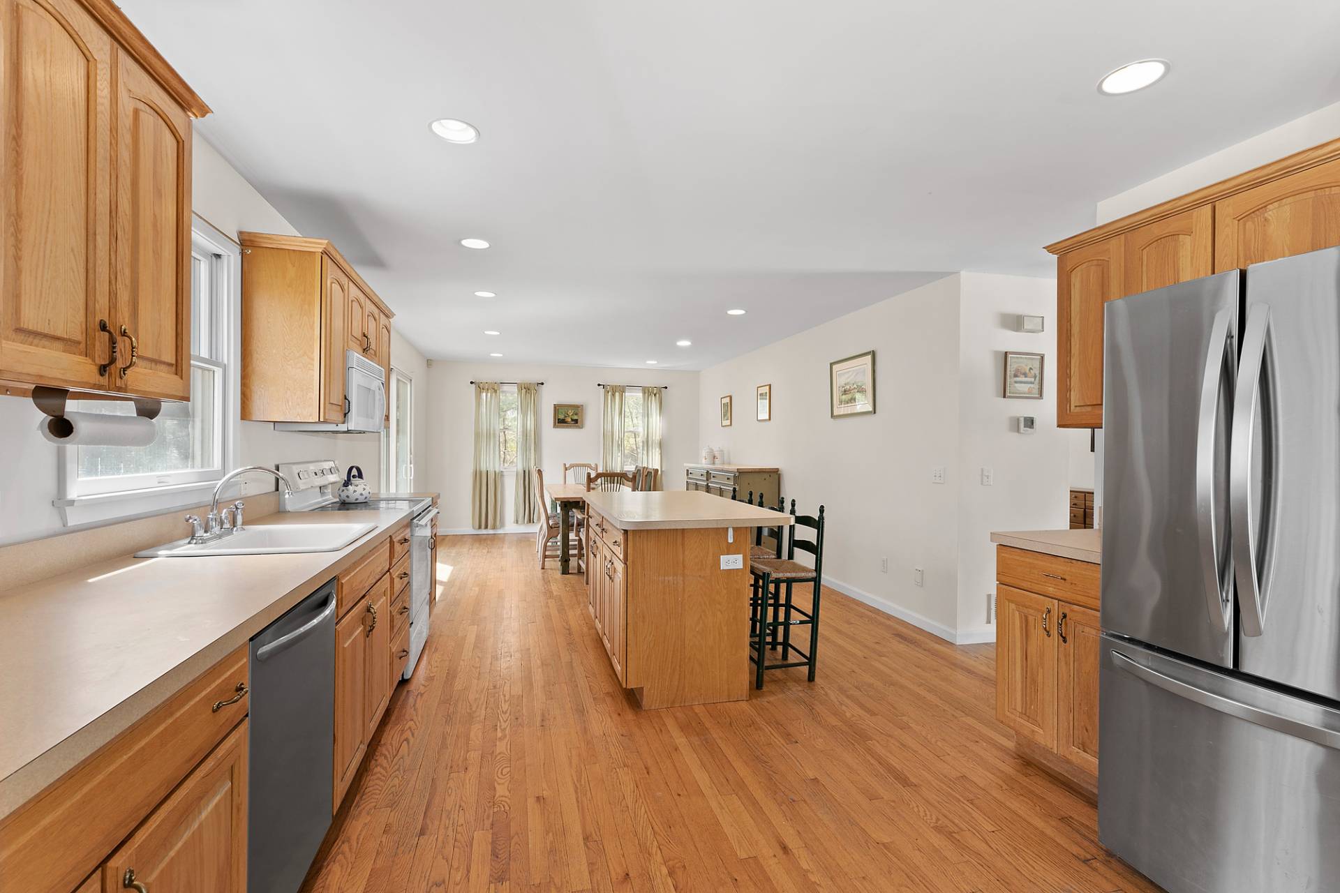 34 Old Fish Cove Road Southampton, NY 11968 - Photo 7 of 17 a kitchen with a sink appliances and cabinets