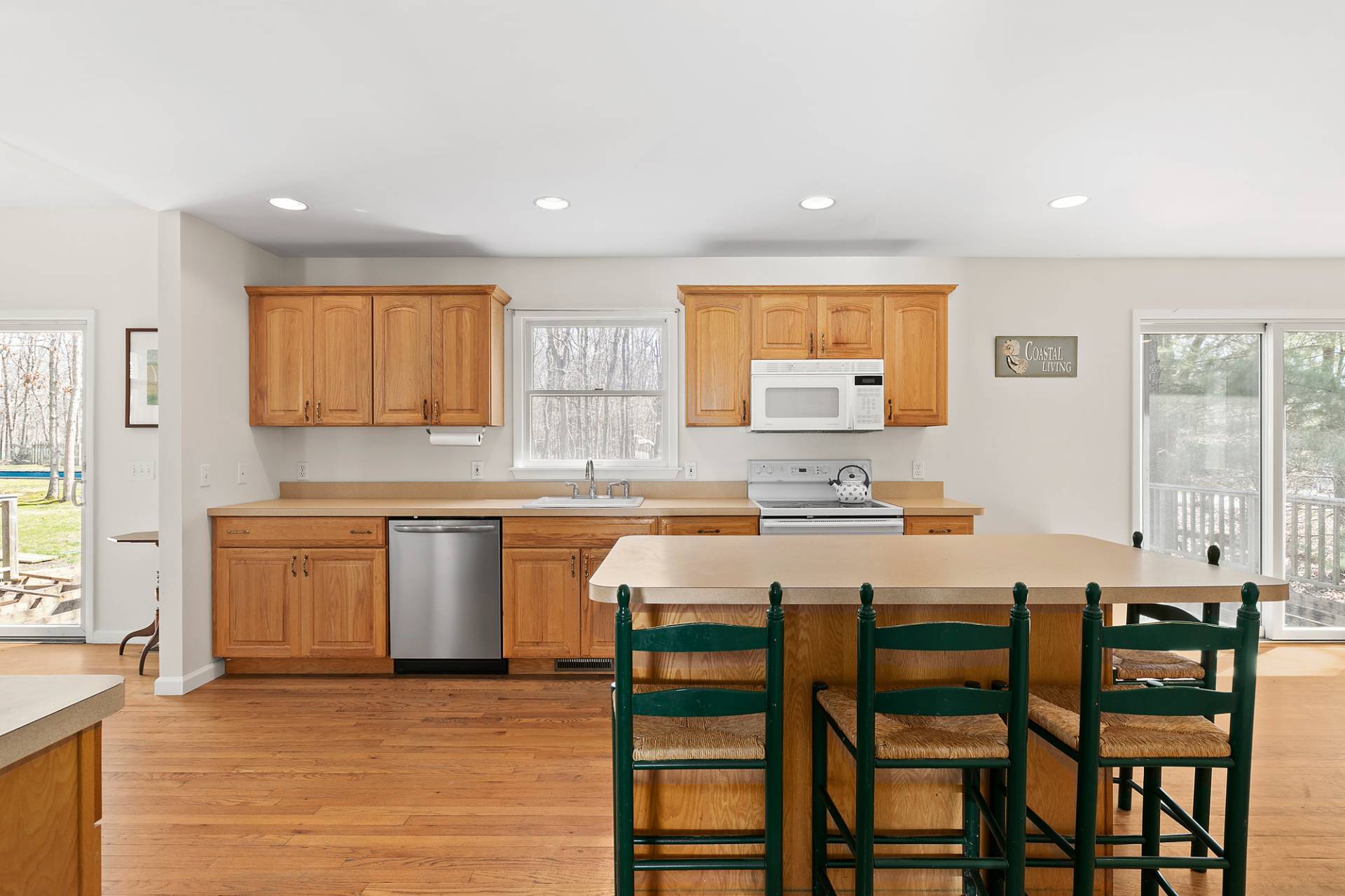 34 Old Fish Cove Road Southampton, NY 11968 - Photo 8 of 17 a kitchen with a dining table chairs and window
