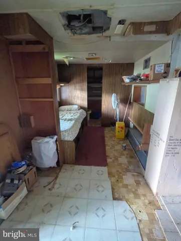 a bed room with a bed furniture and a tv