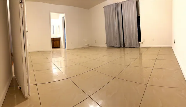 a view of a utility room with windows