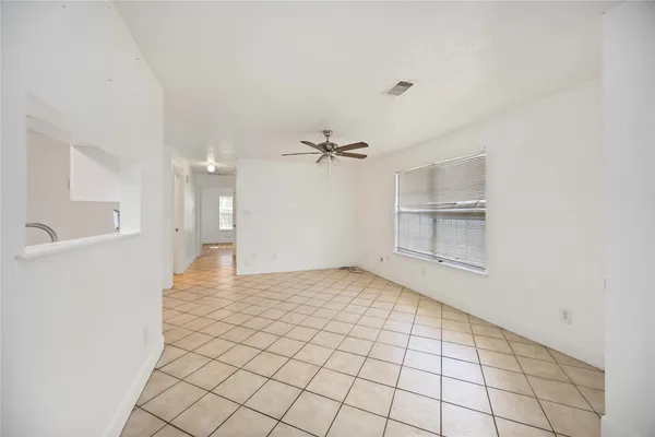 a view of an empty room and a windows