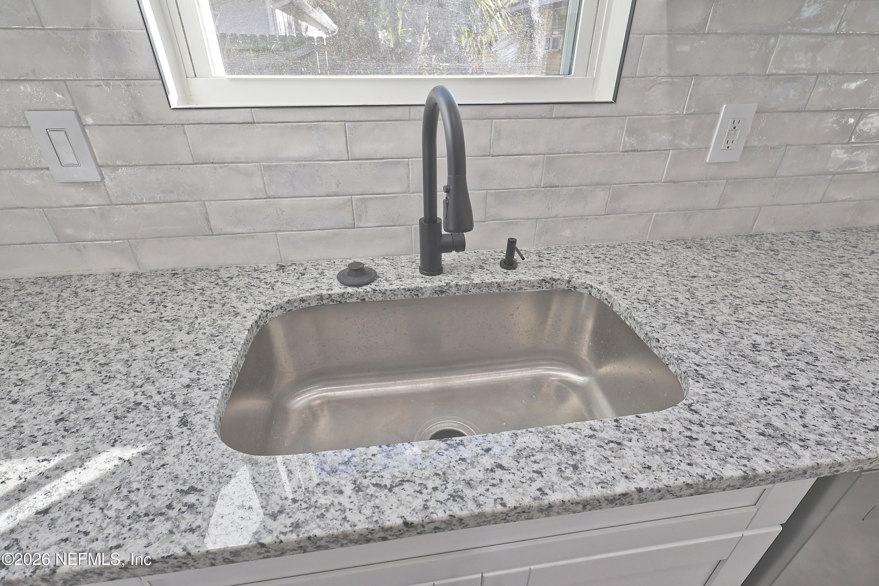 30 Delmonte Street Baldwin, FL 32234 - Photo 11 of 37 a bathroom with a bathtub