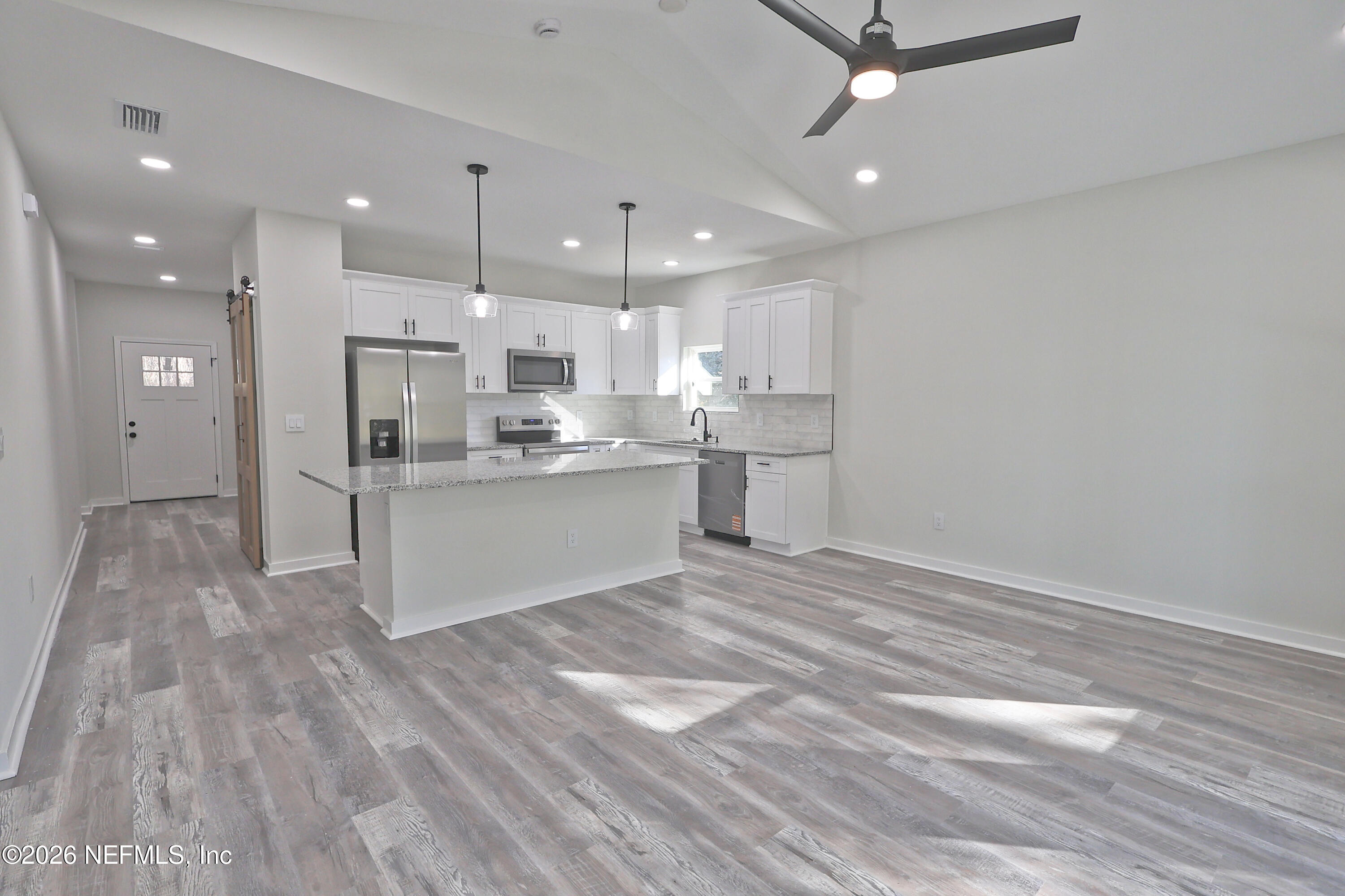 30 Delmonte Street Baldwin, FL 32234 - Photo 14 of 37 a view of kitchen and kitchen island