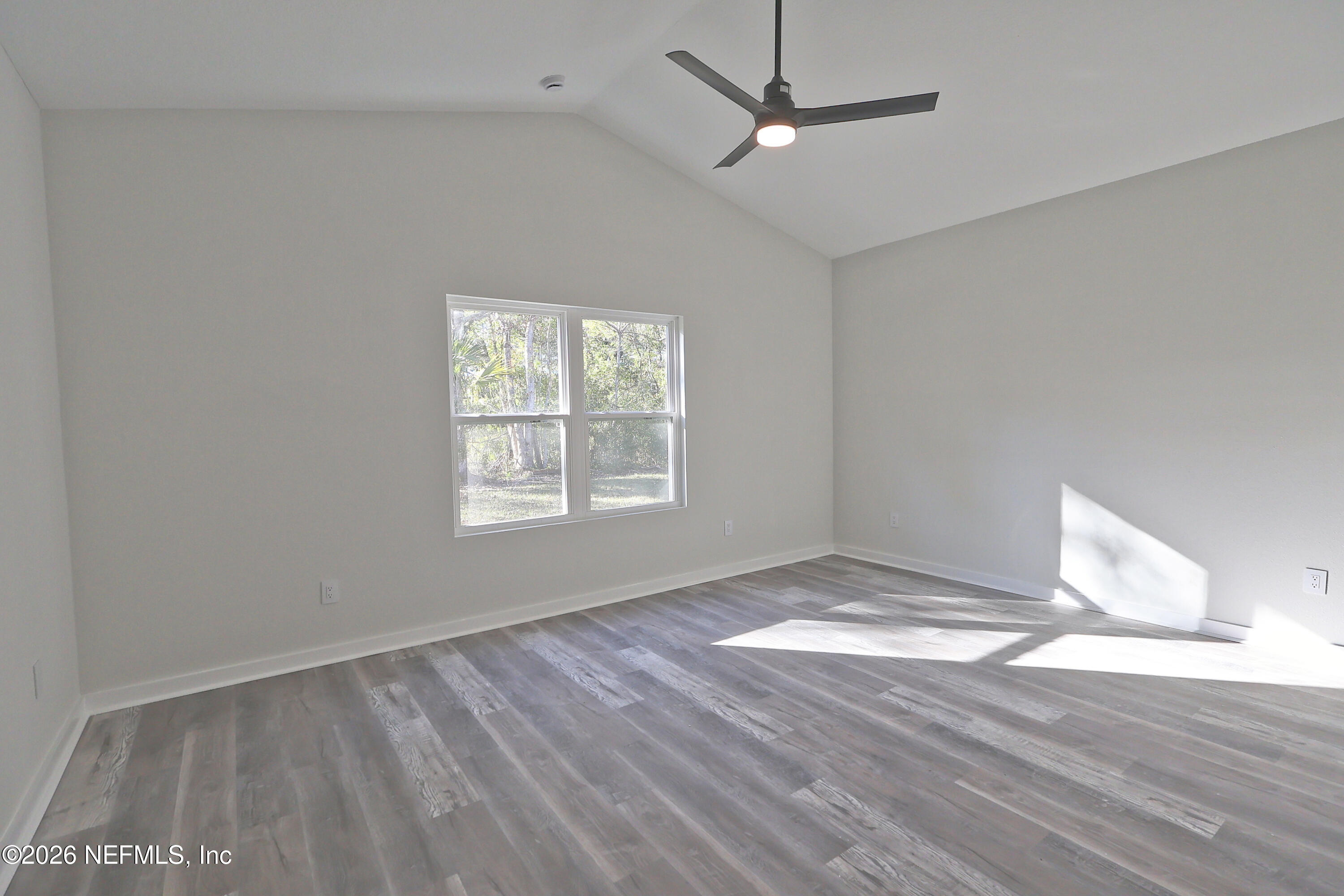 30 Delmonte Street Baldwin, FL 32234 - Photo 16 of 37 wooden floor in an empty room with a window