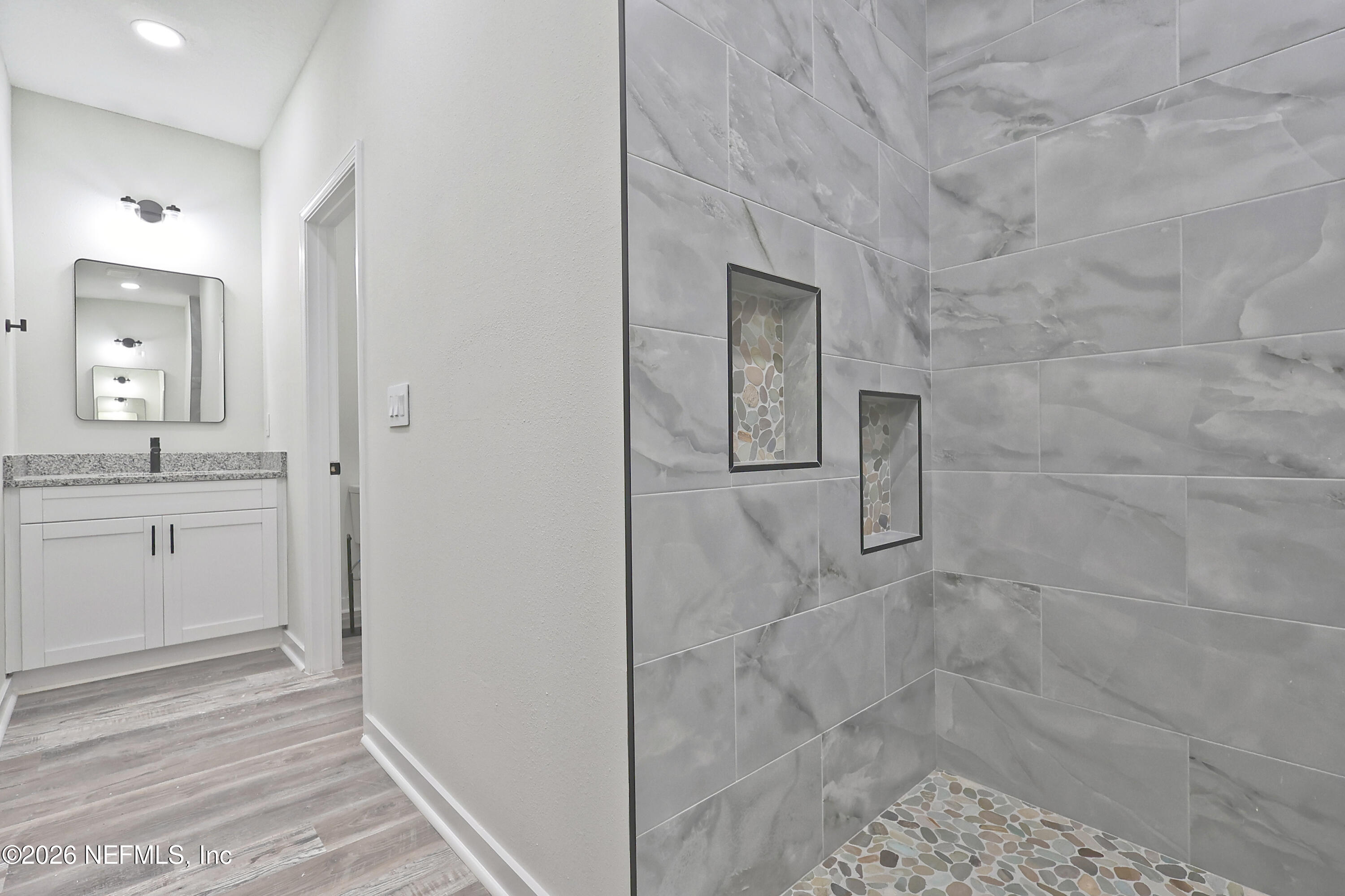 30 Delmonte Street Baldwin, FL 32234 - Photo 21 of 37 a bathroom with a sink and a mirror