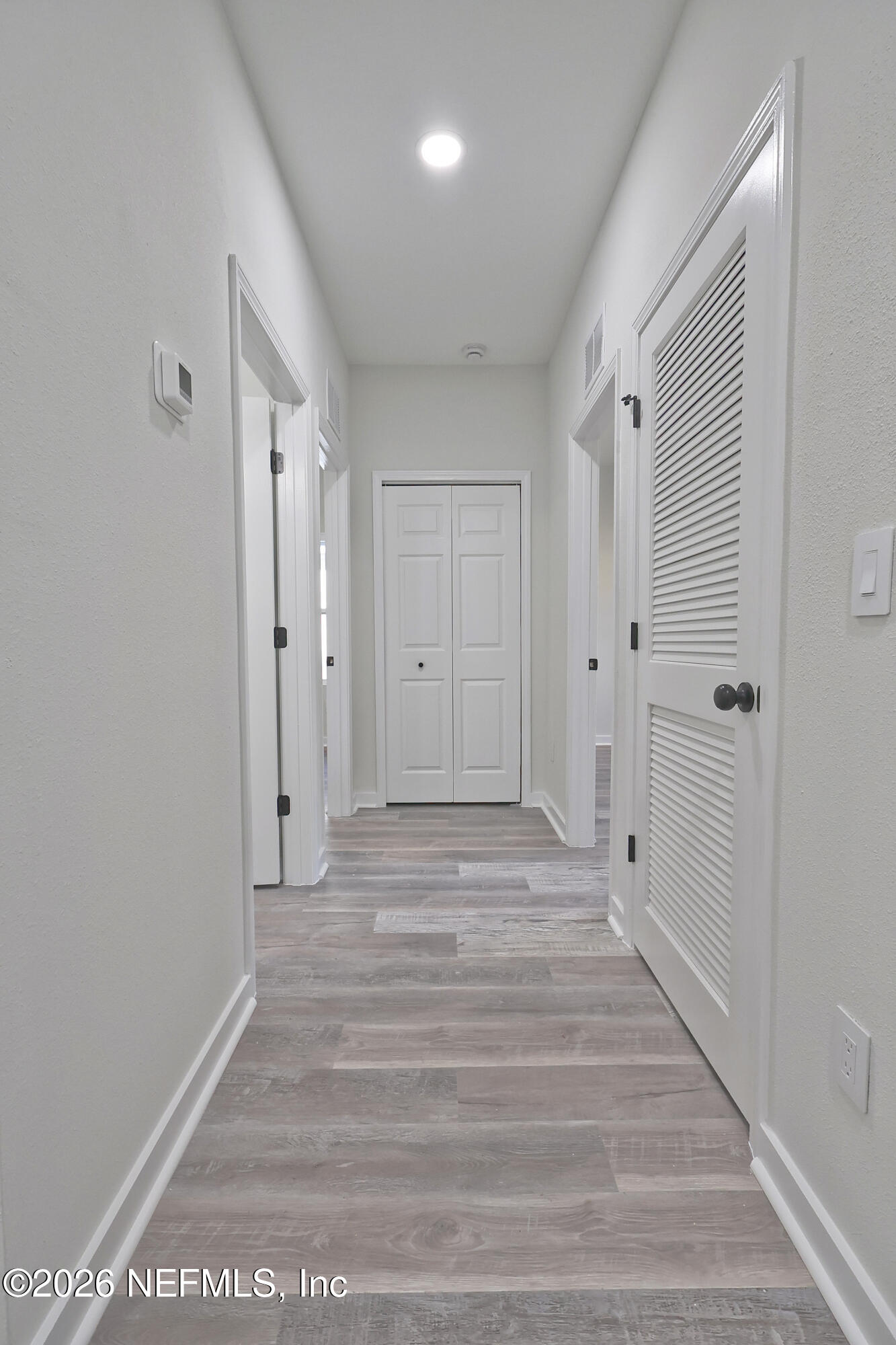 30 Delmonte Street Baldwin, FL 32234 - Photo 24 of 37 a view of a hallway with wooden floor