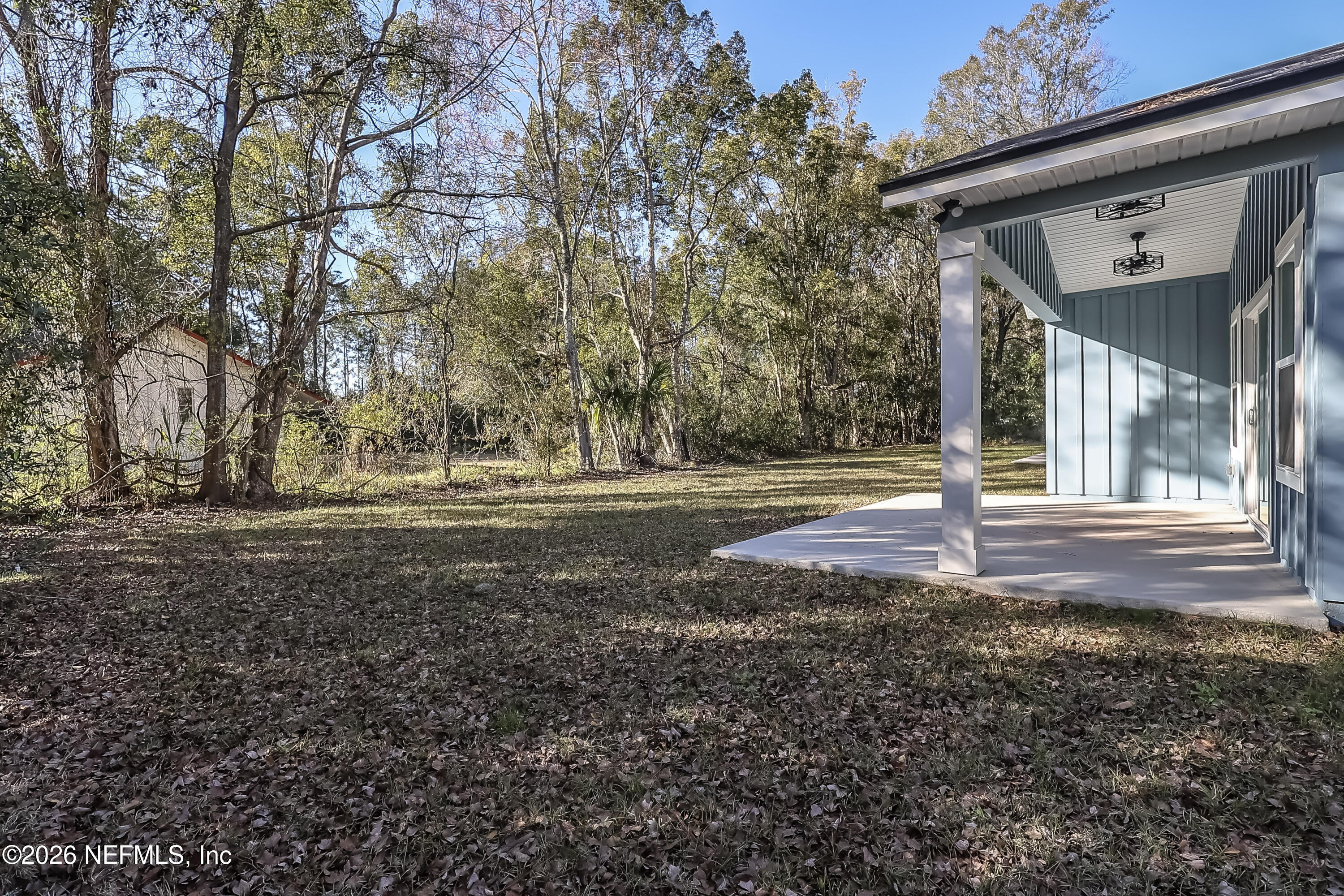 30 Delmonte Street Baldwin, FL 32234 - Photo 34 of 37 a view of dirt yard with large trees
