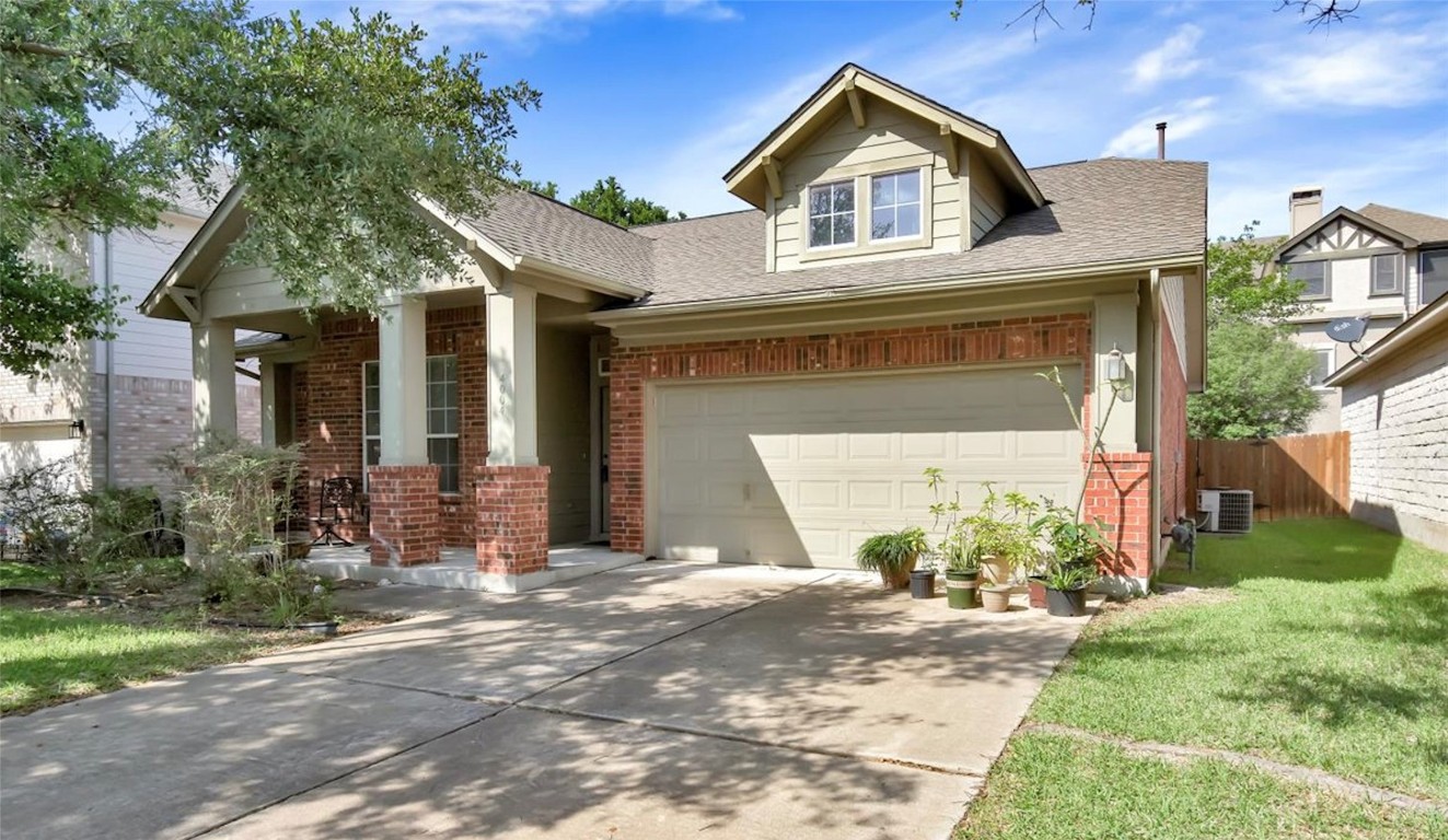 4004 Cargill Drive Round Rock, TX 78681 - Photo 1 of 1 a front view of a house with a yard and garage