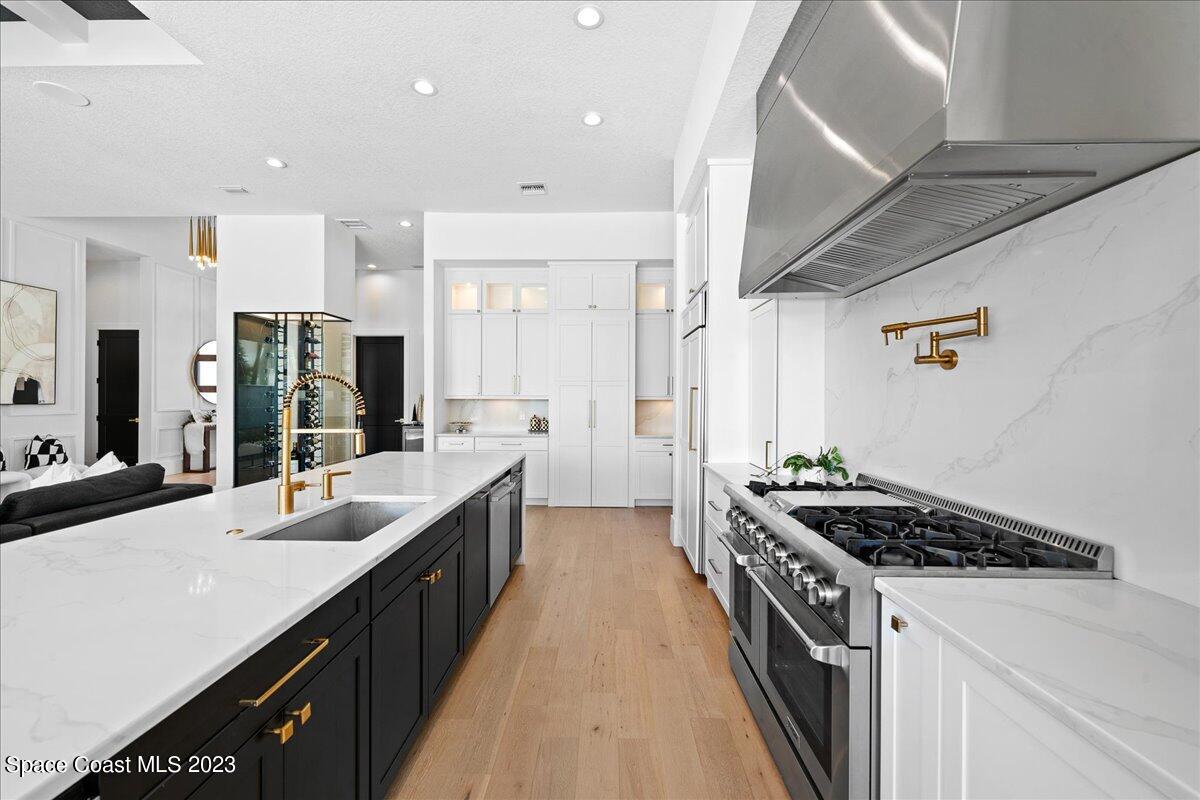 3022 BELLWIND Circle Rockledge, FL 32955 - Photo 11 of 46 a kitchen with a sink stove and cabinets