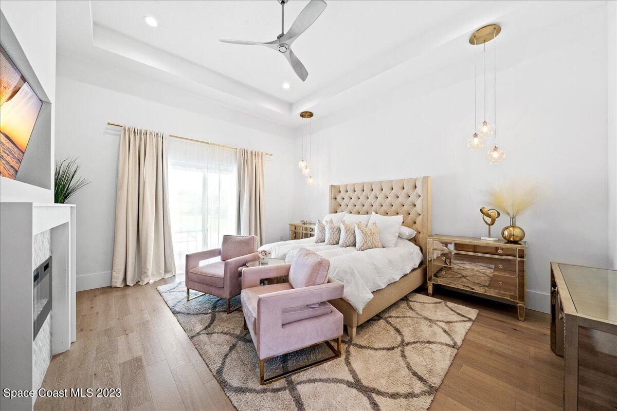 3022 BELLWIND Circle Rockledge, FL 32955 - Photo 17 of 46 a bedroom with furniture and a fireplace