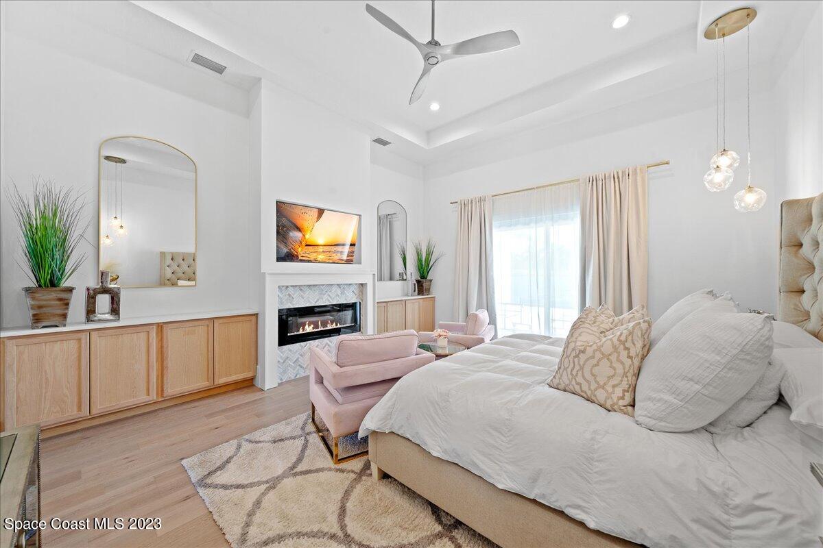 3022 BELLWIND Circle Rockledge, FL 32955 - Photo 18 of 46 a bedroom with a bed and a chandelier