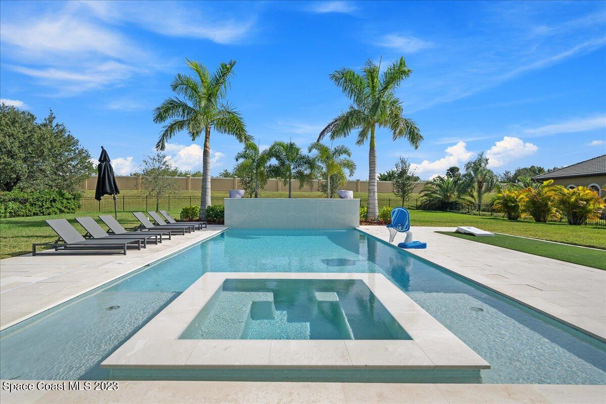 3022 BELLWIND Circle Rockledge, FL 32955 - Photo 2 of 46 a swimming pool with outdoor seating and yard