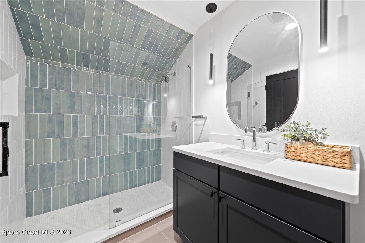 3022 BELLWIND Circle Rockledge, FL 32955 - Photo 35 of 46 a bathroom with a sink and a mirror