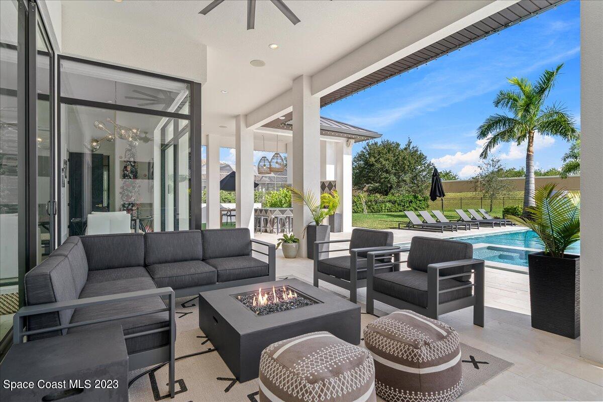 3022 BELLWIND Circle Rockledge, FL 32955 - Photo 37 of 46 a living room with furniture potted plant and a large window