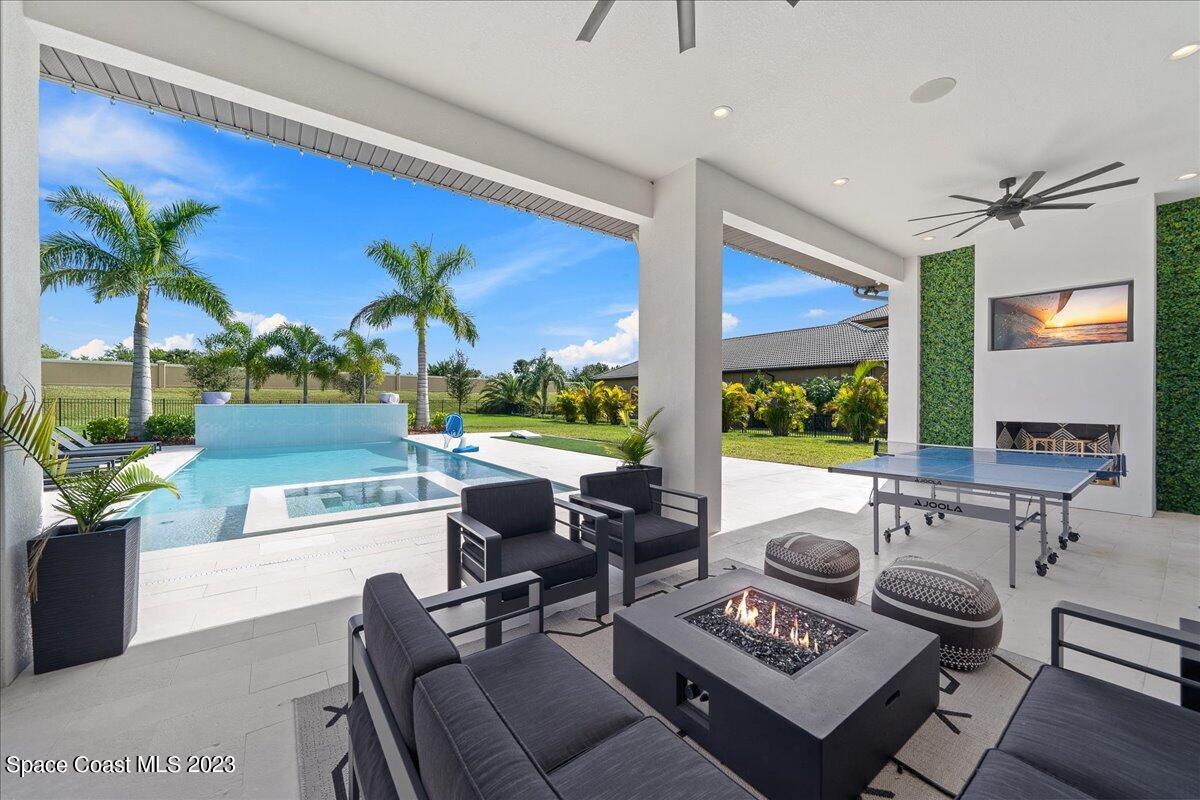 3022 BELLWIND Circle Rockledge, FL 32955 - Photo 38 of 46 a living room with furniture fireplace and a large window