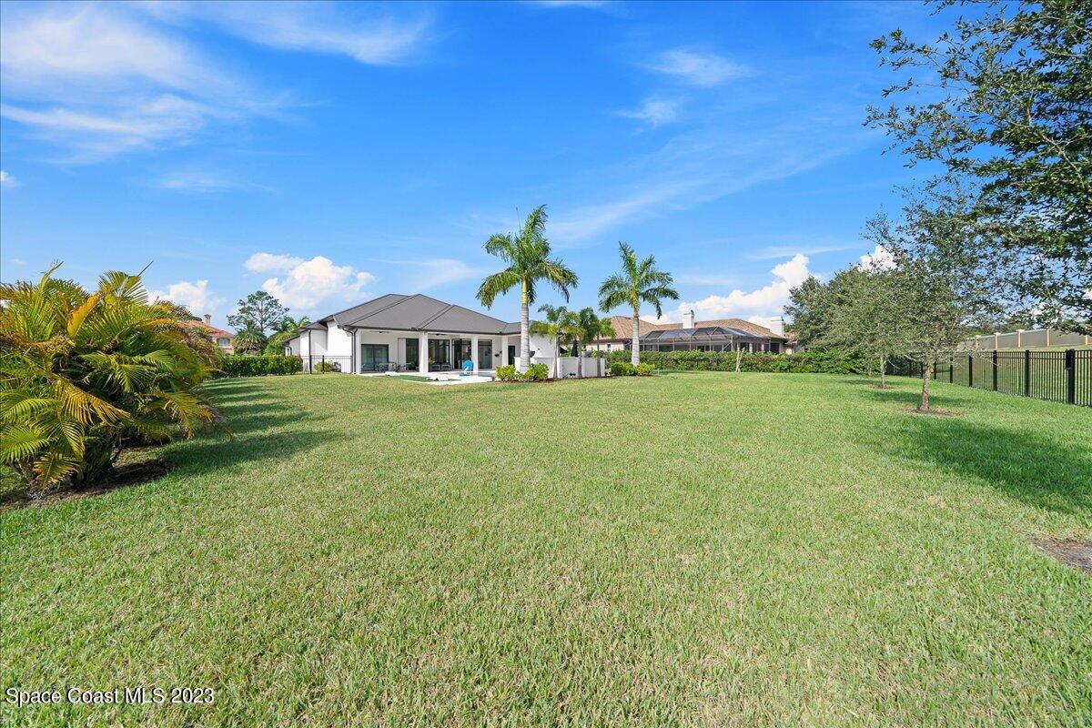 3022 BELLWIND Circle Rockledge, FL 32955 - Photo 42 of 46 a front view of a house with garden